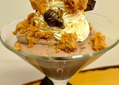 A chocolate mousse served in a martini glass.