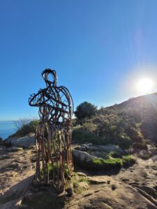 An iron statue of a man looking over Llanbedrog in North Wales.