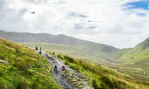  group of hikers following a path up Snowdonia in North Wales